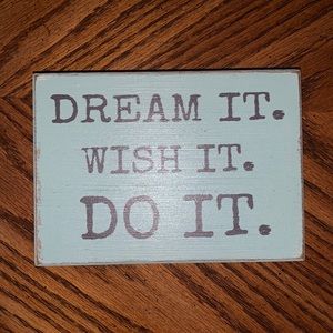 “Dream it. Wish it. Do it.” motivational sign